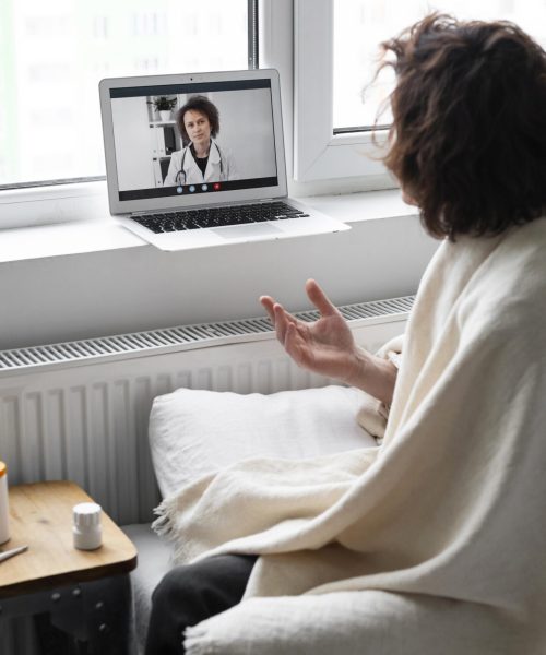 sick-young-man-talking-his-doctor-online